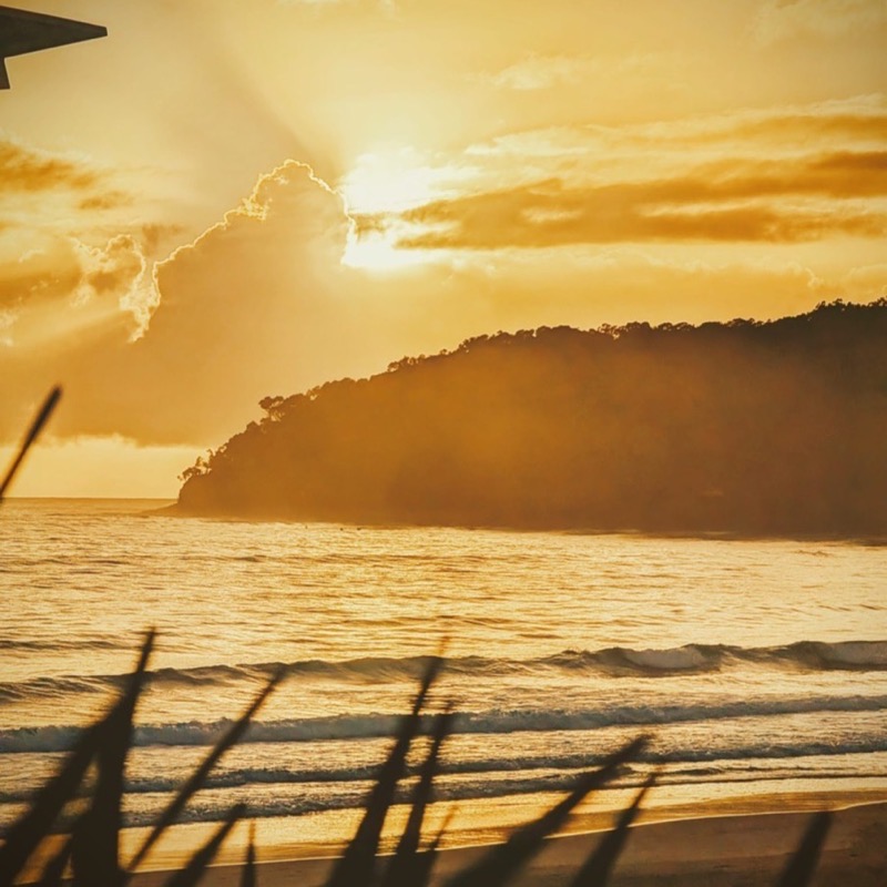 Sunset over the ocean and headland near Noosa